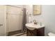 Updated bathroom showcasing a large shower with glass enclosure, and a modern vanity with ample counter space at 923 Dawn St, Venice, FL 34285