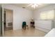 Bedroom with a ceiling fan, Murphy bed, window, and doorway to another room at 923 Dawn St, Venice, FL 34285