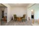 Dining area features a round glass table and seating for four guests at 923 Dawn St, Venice, FL 34285