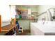Functional laundry room with washer, dryer, storage shelves, and a convenient utility sink at 923 Dawn St, Venice, FL 34285