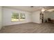 Bright living room with large window and front door with stained glass at 923 Dawn St, Venice, FL 34285