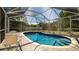 Relax in this lovely screened-in pool, perfect for enjoying sunny days and outdoor entertaining at 923 Dawn St, Venice, FL 34285