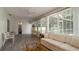 Sunroom offering views of the pool and backyard through large windows at 923 Dawn St, Venice, FL 34285