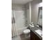 Bathroom exhibiting a tub and shower combination with granite countertop vanity and coordinated fixtures at 10668 Lake Montauk Dr, Riverview, FL 33578