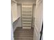Walk-in closet with custom shelving, ideal for organizing clothes, shoes, and personal items at 10668 Lake Montauk Dr, Riverview, FL 33578