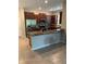 Well-equipped kitchen features granite countertops, stainless steel appliances and rich, dark cabinetry at 10668 Lake Montauk Dr, Riverview, FL 33578
