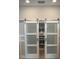 Pantry showcasing white shelving and a variety of kitchen equipment behind sliding doors at 10668 Lake Montauk Dr, Riverview, FL 33578