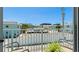 Balcony seating with a scenic view of the property and surrounding buildings at 117 7Th N St # 14, Bradenton Beach, FL 34217