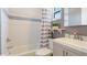 Well-lit bathroom with a shower/tub combination, and neutral color palette at 117 7Th N St # 14, Bradenton Beach, FL 34217