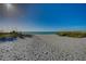 Stunning white sand beach with turquoise water and clear blue skies on a sunny day at 117 7Th N St # 14, Bradenton Beach, FL 34217