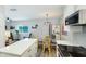 Open-concept living space featuring modern kitchen, dining area, and bright accents at 117 7Th N St # 14, Bradenton Beach, FL 34217