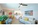 Open-concept living room, kitchen, and dining area with neutral decor and artistic accents at 117 7Th N St # 14, Bradenton Beach, FL 34217