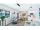 Inviting living room open to kitchen with bright lighting and comfortable seating at 117 7Th N St # 14, Bradenton Beach, FL 34217