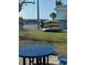 Community recreation area featuring kayak storage and picnic tables on a sunny day at 117 7Th N St # 14, Bradenton Beach, FL 34217