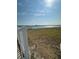 Peaceful waterfront view with calm waters and distant pier visible from the property at 117 7Th N St # 14, Bradenton Beach, FL 34217