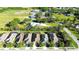 An aerial view of the neighborhood highlights the houses and lush landscapes with views of equestrian activities nearby at 11836 Crawford Parrish Ln, Parrish, FL 34219