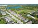This aerial shot of the home shows proximity to a pond, and other homes in this suburban neighborhood at 11836 Crawford Parrish Ln, Parrish, FL 34219