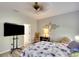 Relaxing bedroom with TV, cool colors, and decorations for a tranquil space at 11836 Crawford Parrish Ln, Parrish, FL 34219