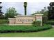 Elegant 'Forest Creek' community sign surrounded by manicured greenery and stone accents at 11836 Crawford Parrish Ln, Parrish, FL 34219