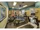 Well-equipped fitness center with modern exercise machines, weights, and natural light at 11836 Crawford Parrish Ln, Parrish, FL 34219