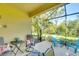 Relaxing screened lanai with ample seating and picturesque views of the surrounding landscape at 11836 Crawford Parrish Ln, Parrish, FL 34219