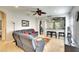 Inviting living room with a plush gray sectional sofa and an open layout into the kitchen at 11836 Crawford Parrish Ln, Parrish, FL 34219