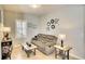 Inviting living room features neutral colors, tile flooring, decorative accents and a large window at 11836 Crawford Parrish Ln, Parrish, FL 34219