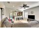 Comfortable living room flows to kitchen; features ceiling fan and view to screened patio at 11836 Crawford Parrish Ln, Parrish, FL 34219