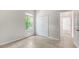 Cozy bedroom with large window, closet and neutral colors at 12041 Thornhill Ct, Lakewood Ranch, FL 34202
