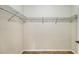 Spacious closet with built in wire rack shelving and tile flooring, ready for organizing clothes at 12041 Thornhill Ct, Lakewood Ranch, FL 34202