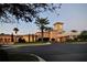 Beautiful clubhouse at twilight with picturesque landscaping and a grand entrance, offering a luxurious ambiance at 12041 Thornhill Ct, Lakewood Ranch, FL 34202