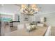 Open-concept dining space adjoins the kitchen and living area, creating a seamless flow for entertaining at 12041 Thornhill Ct, Lakewood Ranch, FL 34202