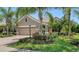Charming single-story home with well-manicured lawn and lush tropical landscaping at 12041 Thornhill Ct, Lakewood Ranch, FL 34202