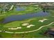Picturesque aerial view of the golf course with lush green fairways and serene water hazards at 12041 Thornhill Ct, Lakewood Ranch, FL 34202