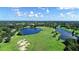 Scenic aerial shot of the golf course showcasing the expansive green landscape and water features at 12041 Thornhill Ct, Lakewood Ranch, FL 34202