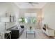 Cozy living room featuring neutral colors, modern furniture, and a large window for natural light at 12041 Thornhill Ct, Lakewood Ranch, FL 34202
