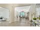 Open living area with tile floors, tray ceilings, and backyard view at 12041 Thornhill Ct, Lakewood Ranch, FL 34202