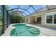Enclosed pool and patio with outdoor dining area at 12041 Thornhill Ct, Lakewood Ranch, FL 34202
