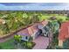 Aerial view of home showcasing mature landscaping and golf course frontage at 15024 Castle Park Ter, Lakewood Ranch, FL 34202