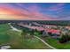 Aerial view of rooftops and golf course features beautiful sky and lush foliage at 15024 Castle Park Ter, Lakewood Ranch, FL 34202