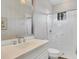 Clean bathroom with a white vanity, shower, and neutral tones, creating a refreshing and functional space at 15024 Castle Park Ter, Lakewood Ranch, FL 34202