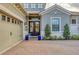 Charming entryway featuring a double door, bench, and meticulously kept landscape at 15024 Castle Park Ter, Lakewood Ranch, FL 34202