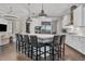Large open kitchen features a center island with seating and stainless-steel appliances at 15024 Castle Park Ter, Lakewood Ranch, FL 34202