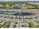 Aerial view of a Primary-planned community showcasing lush landscaping, picturesque lakes, and modern homes at 15104 Blue Bay Ter, Lakewood Ranch, FL 34211