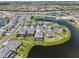 An elevated view highlights the waterfront homes nestled around winding lakes in a vibrant neighborhood at 15104 Blue Bay Ter, Lakewood Ranch, FL 34211