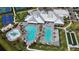 Aerial view features community splash pad, swimming pool, bocce ball, and basketball courts at 15104 Blue Bay Ter, Lakewood Ranch, FL 34211