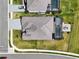 An elevated shot reveals a well-kept house with a fenced yard, screened pool, and an inviting patio area at 15104 Blue Bay Ter, Lakewood Ranch, FL 34211