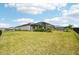 Large backyard with covered patio and ample green space at 15104 Blue Bay Ter, Lakewood Ranch, FL 34211