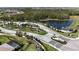 Scenic entrance to the community with lush landscaping, walking paths, and a tranquil pond at 15104 Blue Bay Ter, Lakewood Ranch, FL 34211