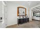 Elegant entryway featuring a black console table and modern decor at 15104 Blue Bay Ter, Lakewood Ranch, FL 34211